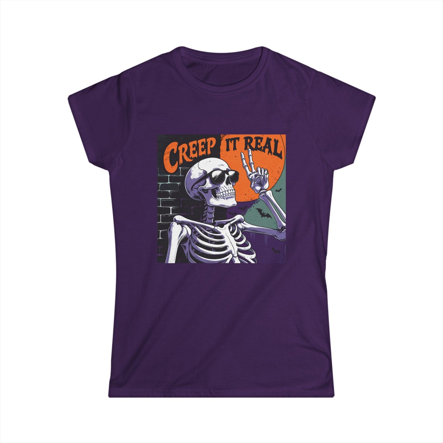 Purple t-shirt with a skeleton graphic and 'Creep It Real' text on a white background