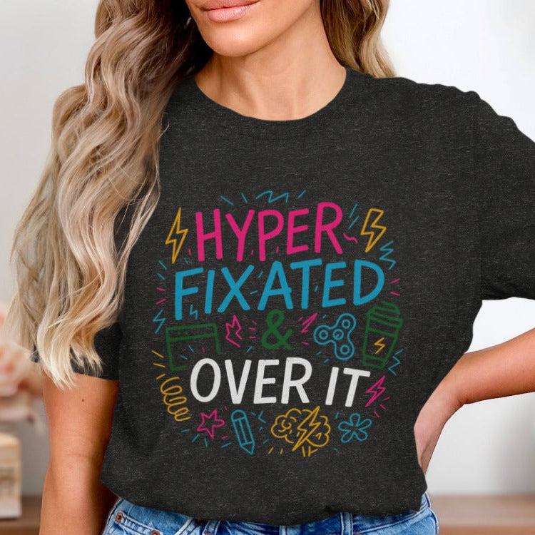 Person wearing a black t-shirt with colorful text design