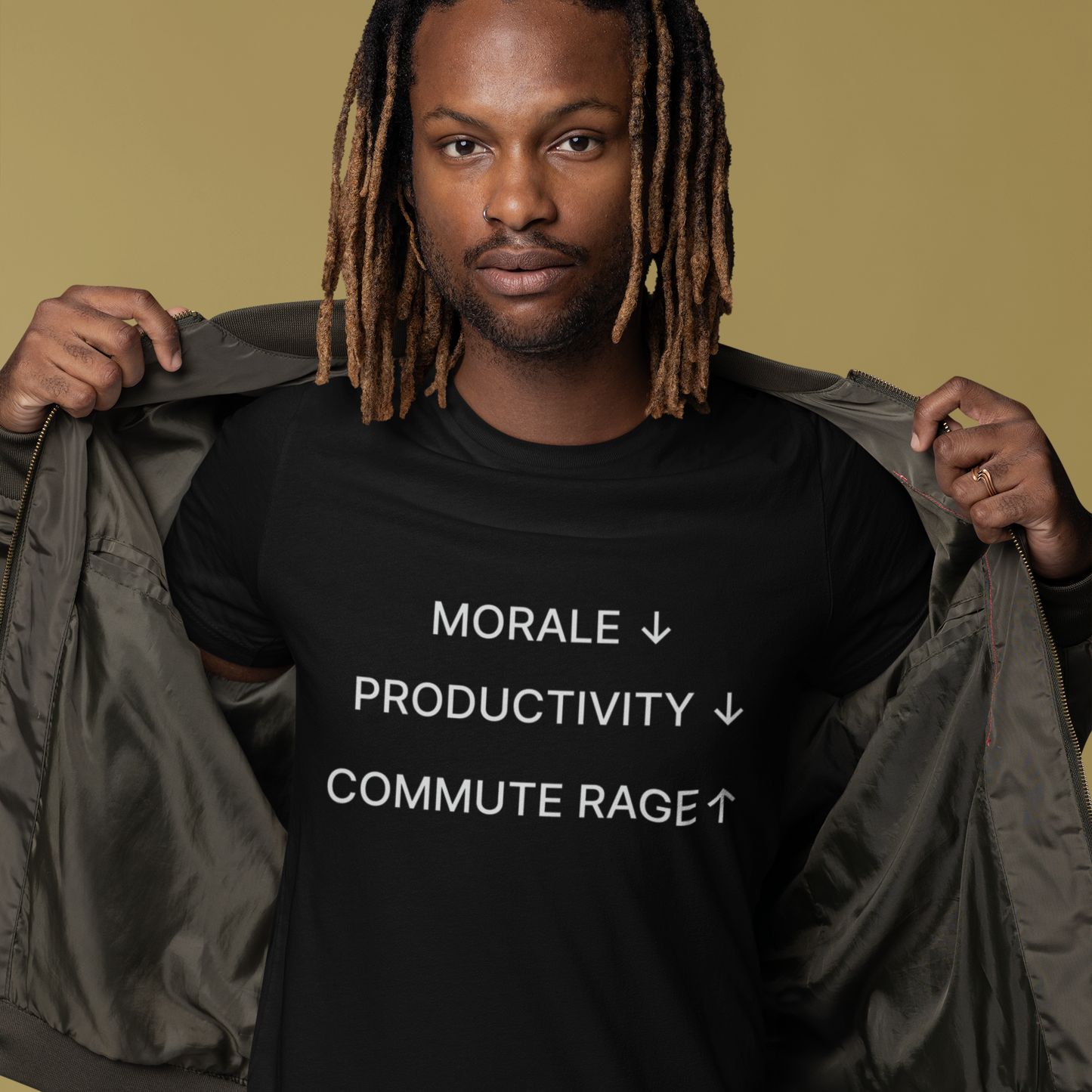 Person wearing a black t-shirt with text on a beige background