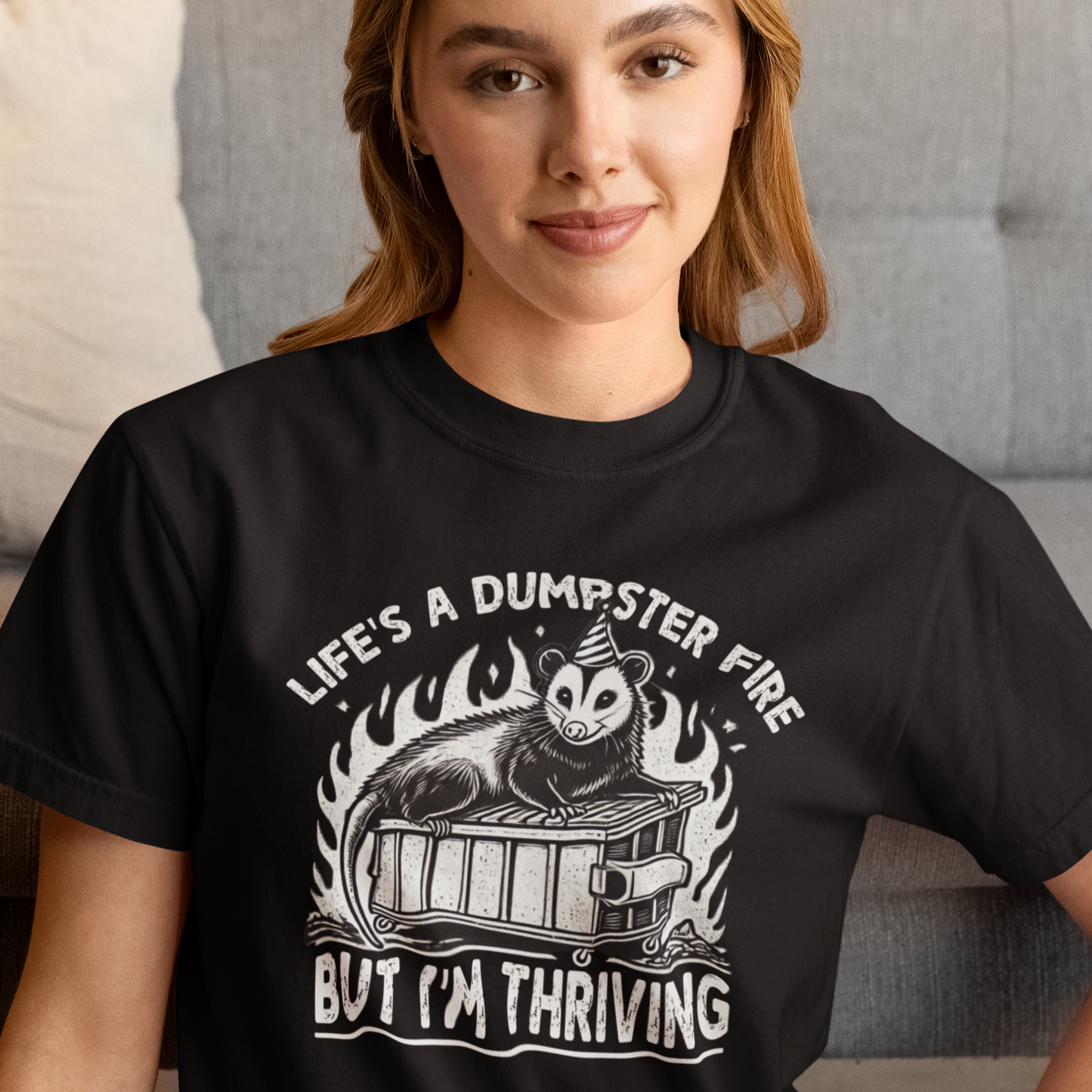 Person wearing a black t-shirt with a graphic design and text.