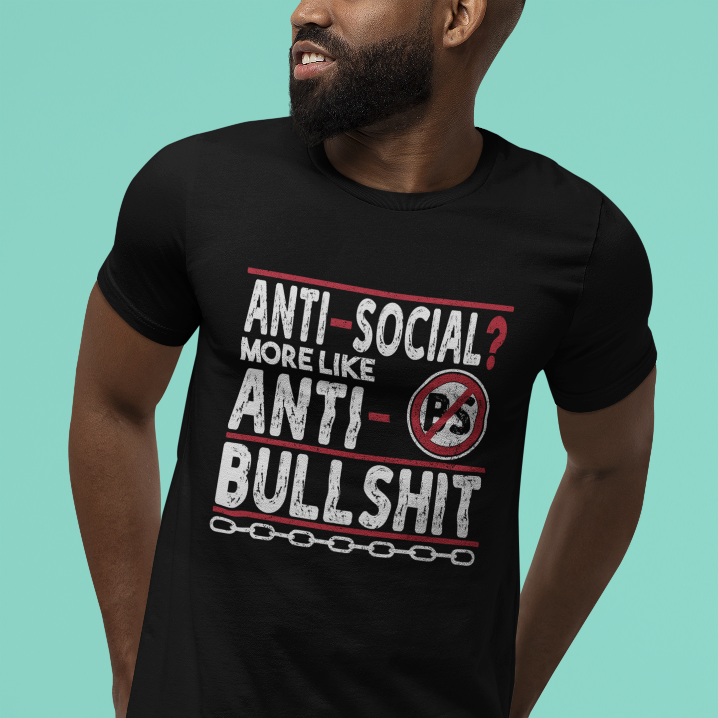 Person wearing a black t-shirt with humorous text design on a teal background