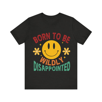 Black t-shirt with a smiley face and text 'Born to be Wildly Disappointed' on a white background