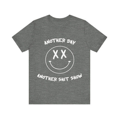 Gray t-shirt with white text Another Day Another Shit Show and smiley face design on a white background
