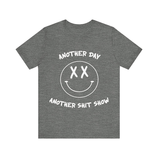 Gray t-shirt with white text Another Day Another Shit Show and smiley face design on a white background