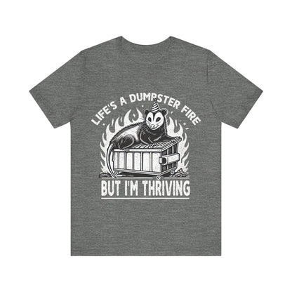 Gray t-shirt with graphic design and text on a white background
