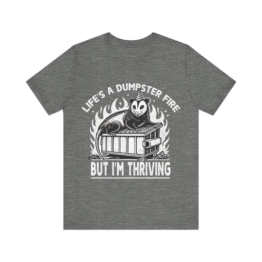 Gray t-shirt with graphic design and text on a white background