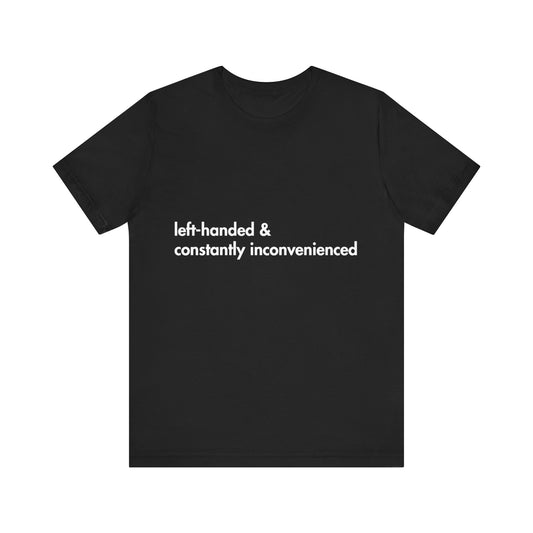 Black t-shirt with white text 'left-handed & constantly inconvenienced' on a white background