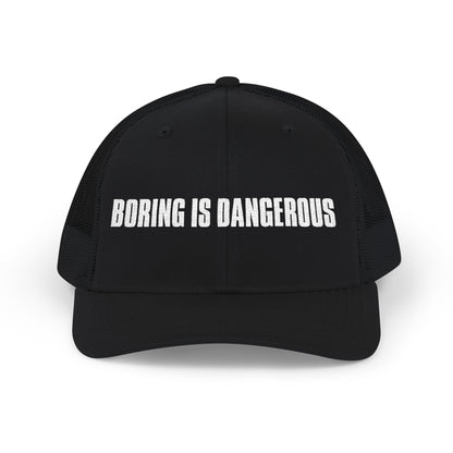 Black cap with 'Boring is Dangerous' text on a white background