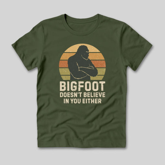 Green t-shirt with a Bigfoot graphic and text on a light gray background