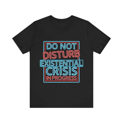 Black t-shirt with colorful text 'DO NOT DISTURB EXISTENTIAL CRISIS IN PROGRESS' on a white background