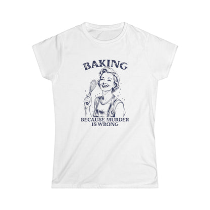 White t-shirt with a graphic of a woman baking and text 'Baking because murder is wrong' on a white background