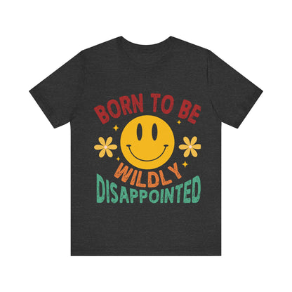Black t-shirt with a smiley face and text 'Born to be Wildly Disappointed' on a white background