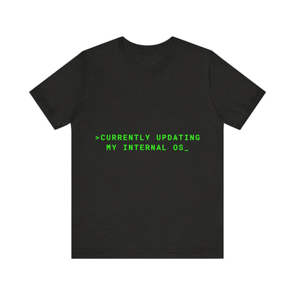 Black t-shirt with green text 'CURRENTLY UPDATING MY INTERNAL OS_' on a white background