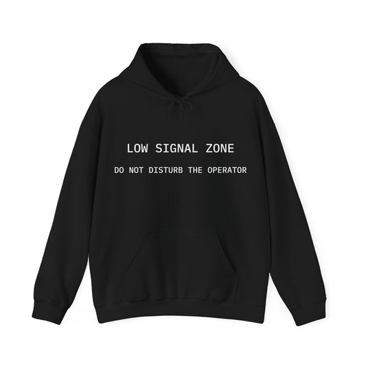 Black hoodie with text 'LOW SIGNAL ZONE DO NOT DISTURB THE OPERATOR' on a white background