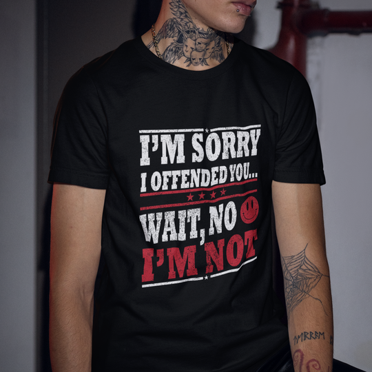 Person wearing a black t-shirt with humorous text design.