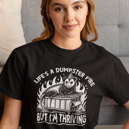 Person wearing a black t-shirt with a graphic design and text.