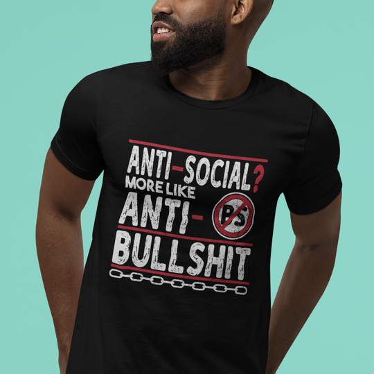 Person wearing a black t-shirt with humorous text design on a teal background